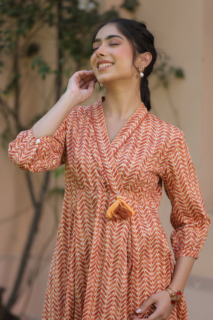 Orange Pure Cotton Tribal Print Fancy Tussle Work Flared Designer Dress
