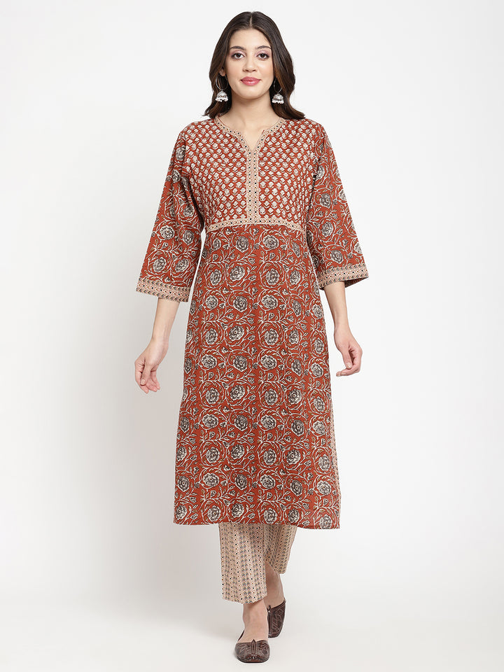 Woman posing in Savi's Cotton Block Printed rust beige Kurta with Pant