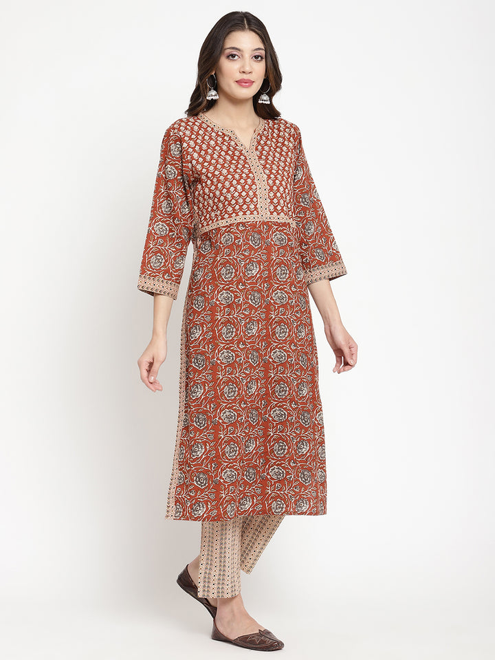 Woman posing in Savi's Cotton Block Printed rust beige Kurta with Pant