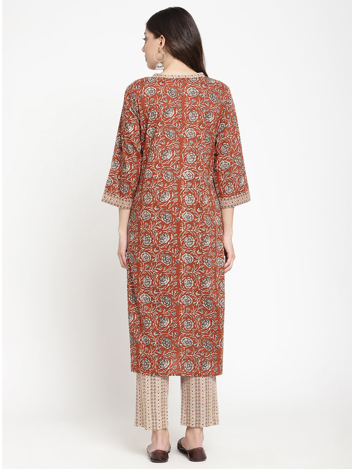 Woman posing in Savi's Cotton Block Printed rust beige Kurta with Pant