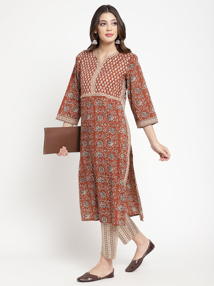 Woman posing in Savi's Cotton Block Printed rust beige Kurta with Pant