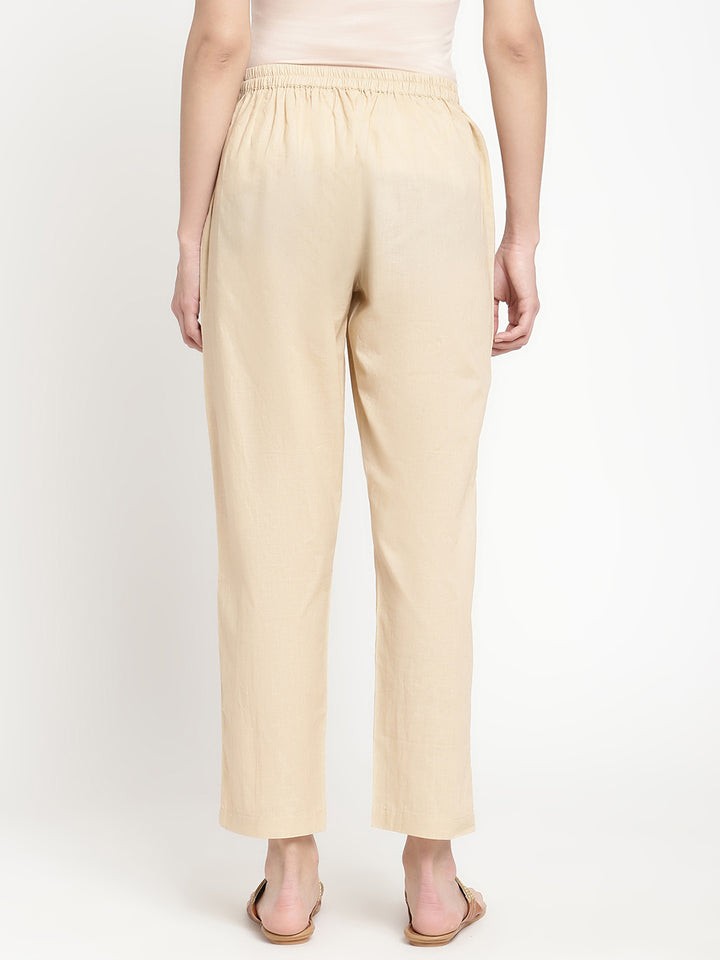 Beige cotton straight pant crafted by a homegrown brand named Savi.