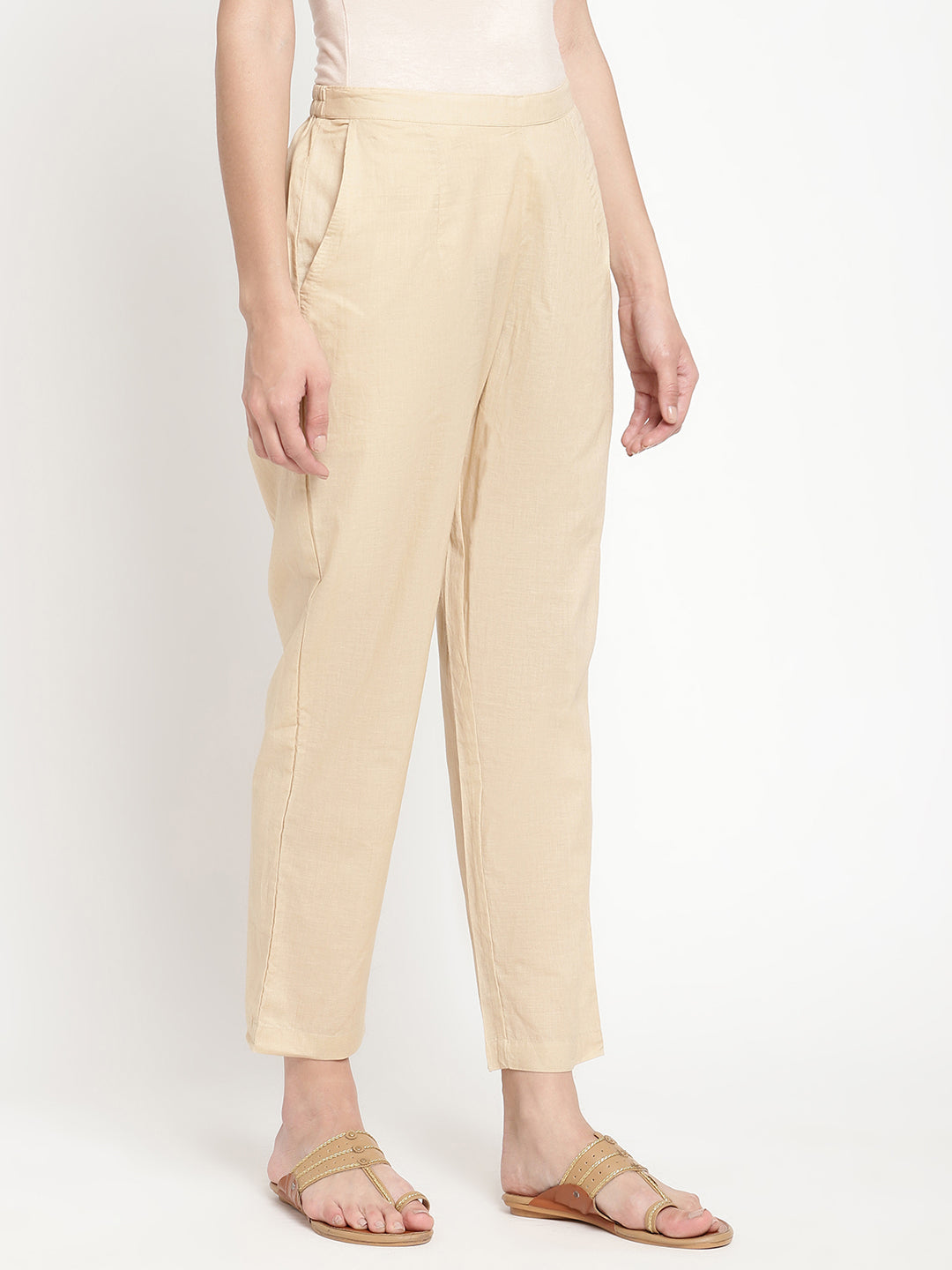 Beige cotton straight pant crafted by a homegrown brand named Savi.