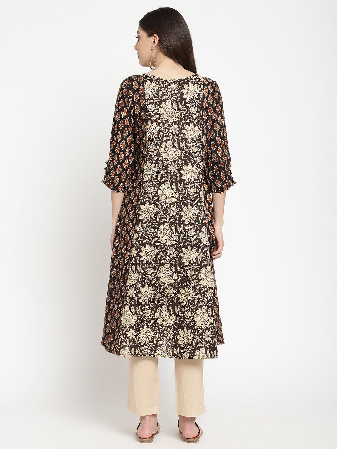 Woman posing in Beige and Black Cotton Printed A Line Kurta Dress
