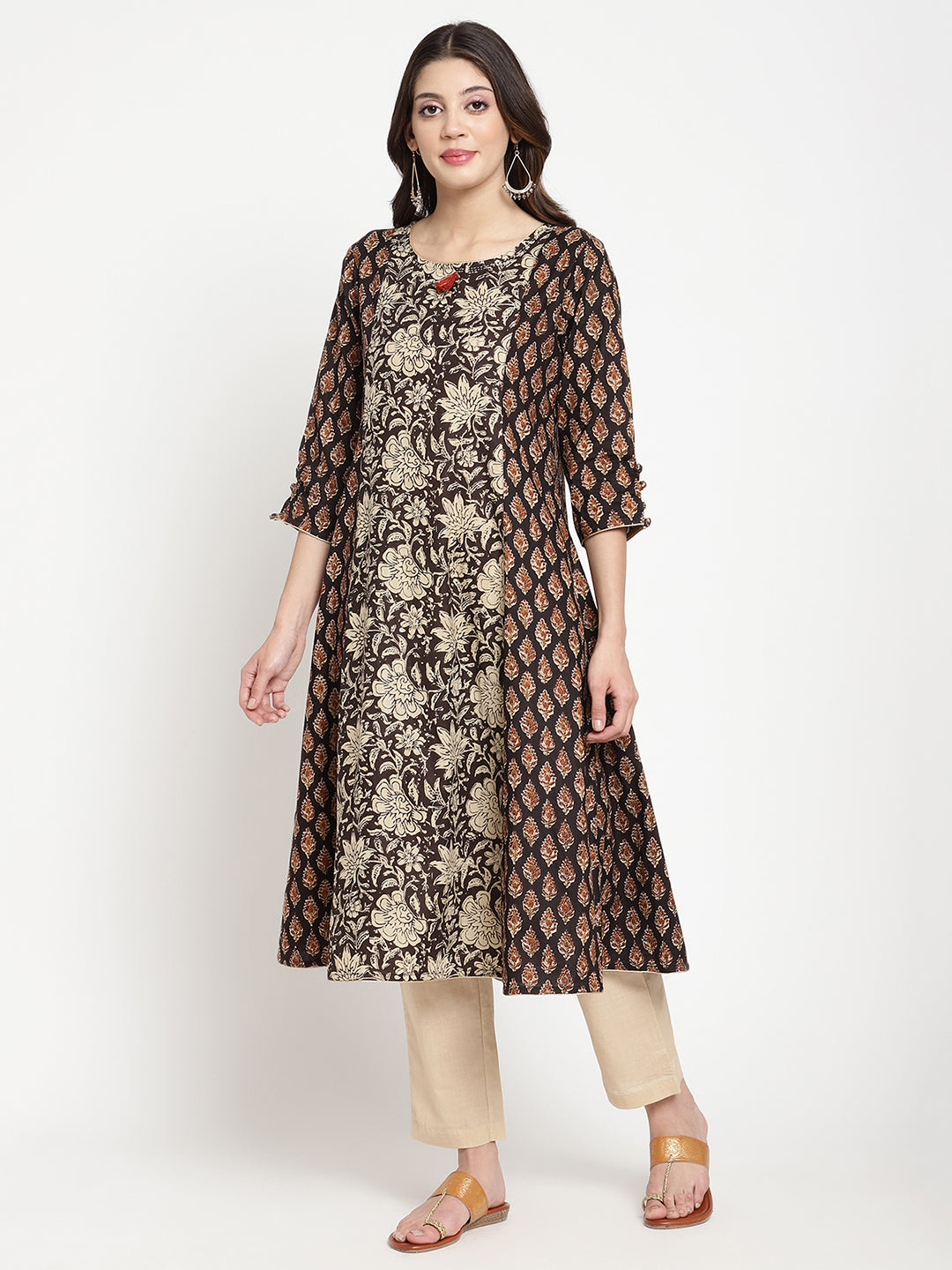 Woman posing in Beige and Black Cotton Printed A Line Kurta Dress