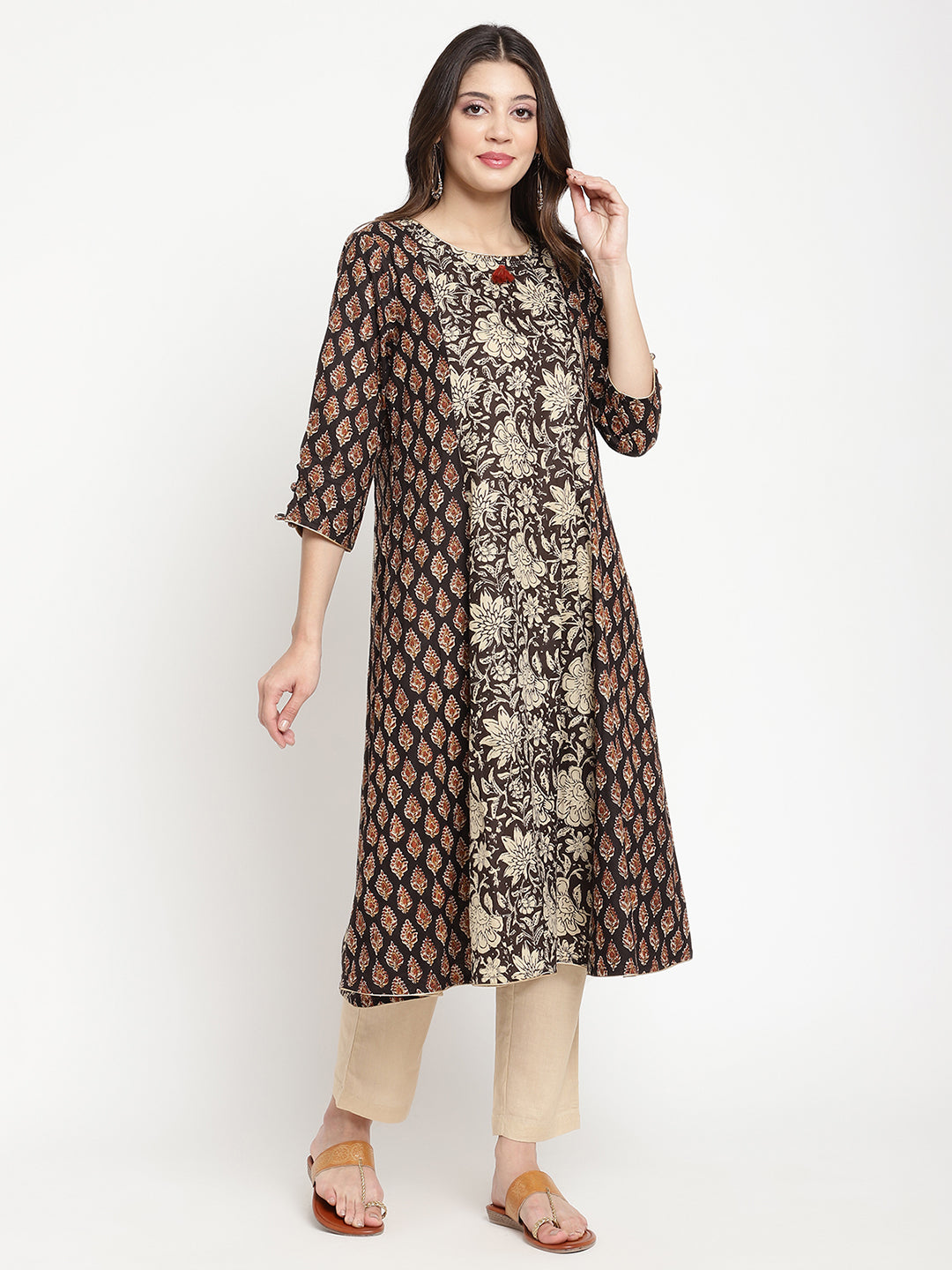 Woman posing in Beige and Black Cotton Printed A Line Kurta Dress