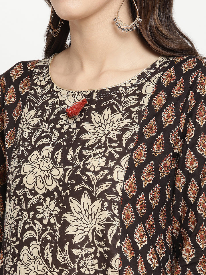 Woman posing in Beige and Black Cotton Printed A Line Kurta Dress