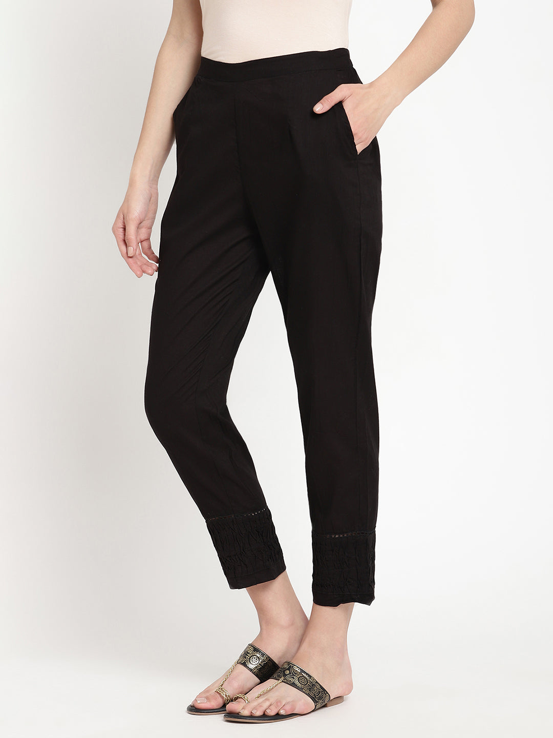 Wide shot of black cotton pintuck pants for women.