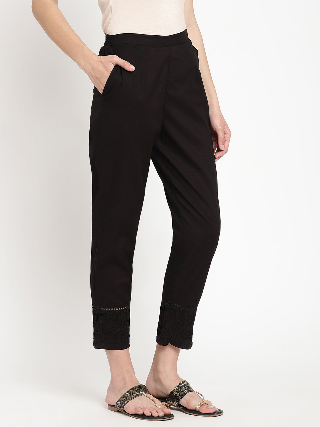 Wide shot of black cotton pintuck pants for women.