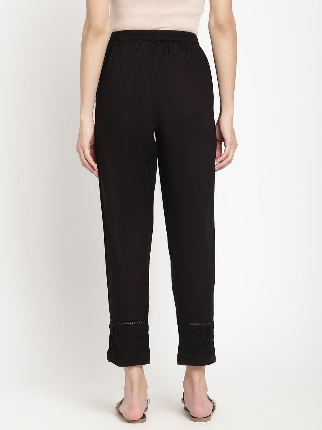 Wide shot of black cotton pintuck pants for women.