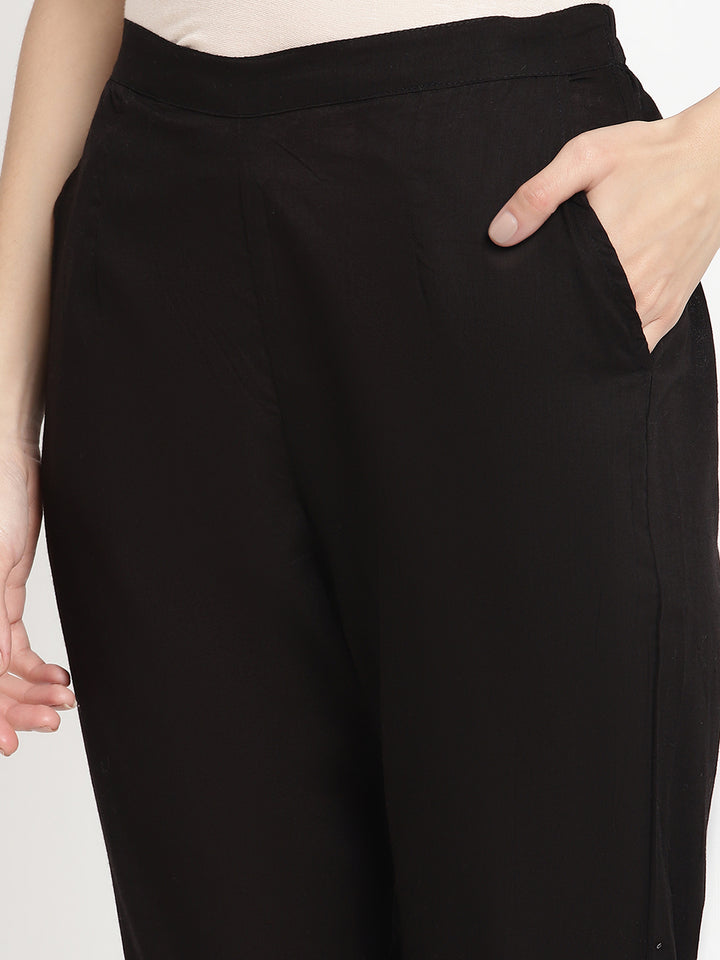 Wide shot of black cotton pintuck pants for women.