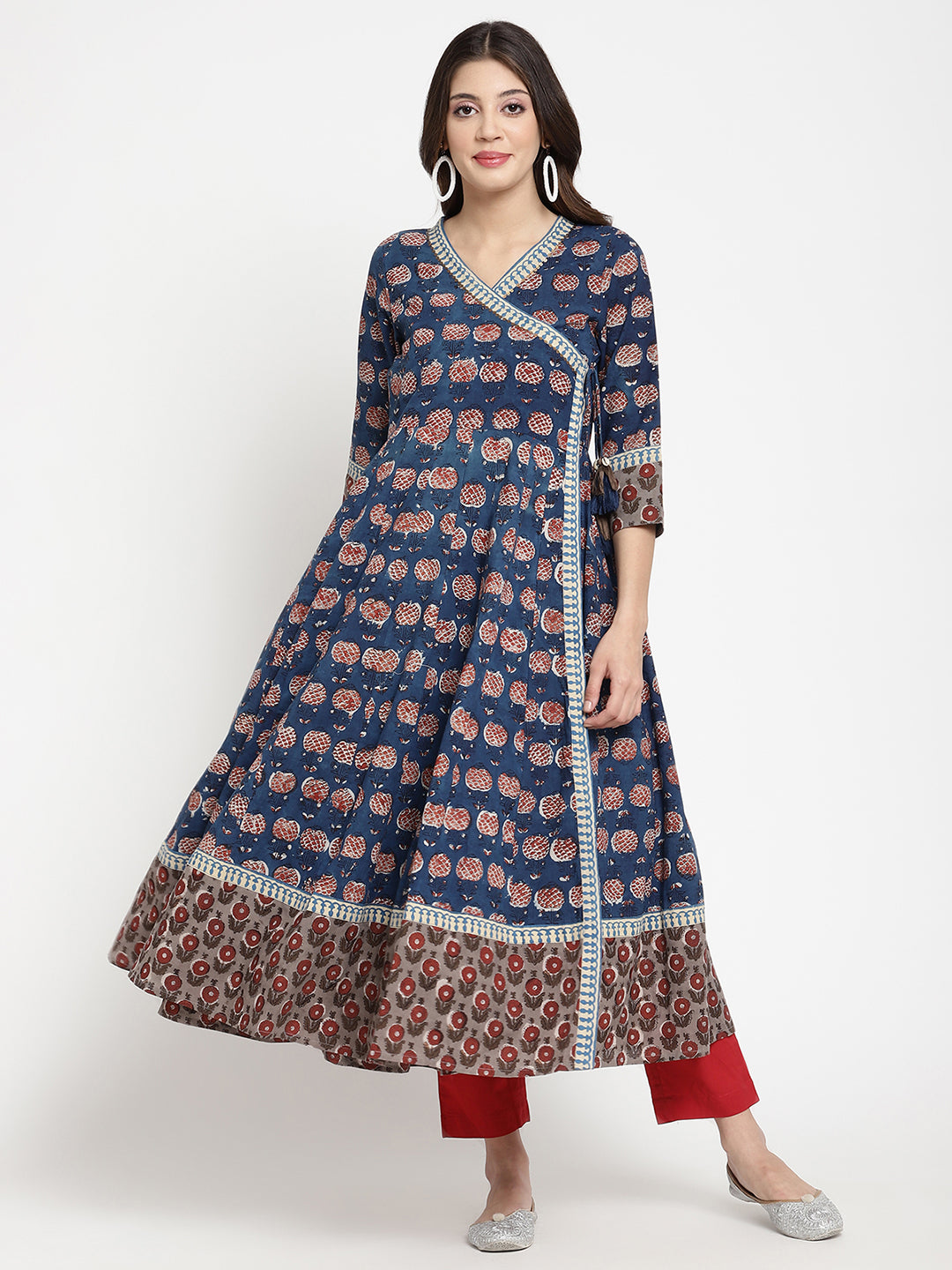 Woman posing in a blue Angrakha Anarkali Kurta.