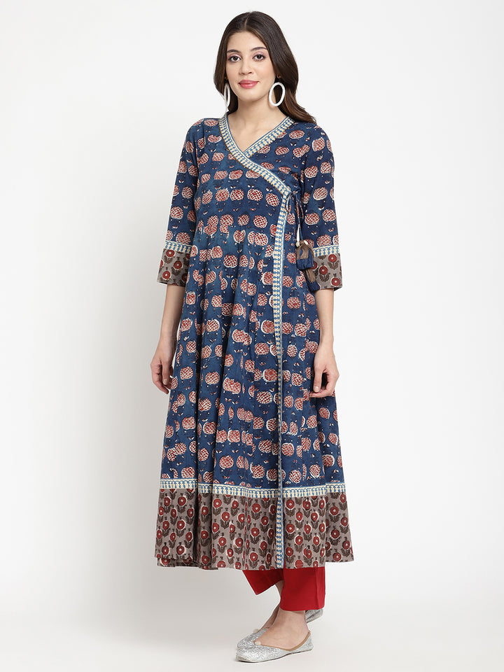 Woman posing in a blue Angrakha Anarkali Kurta.