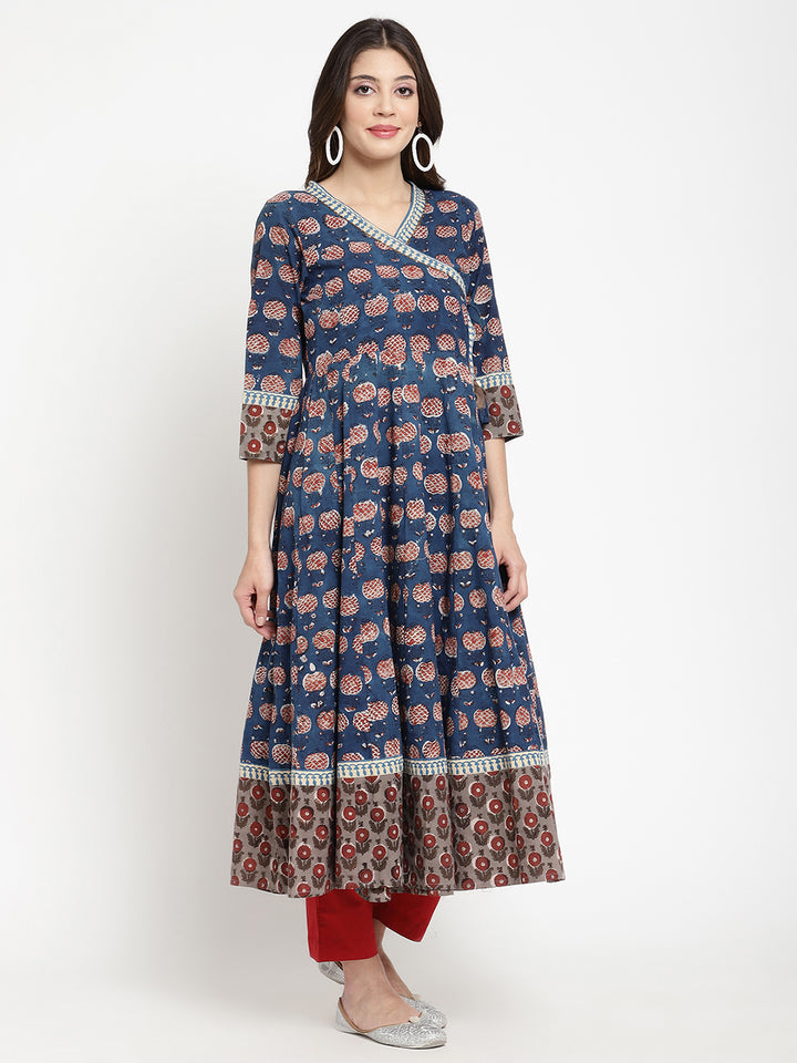 Woman posing in a blue Angrakha Anarkali Kurta.