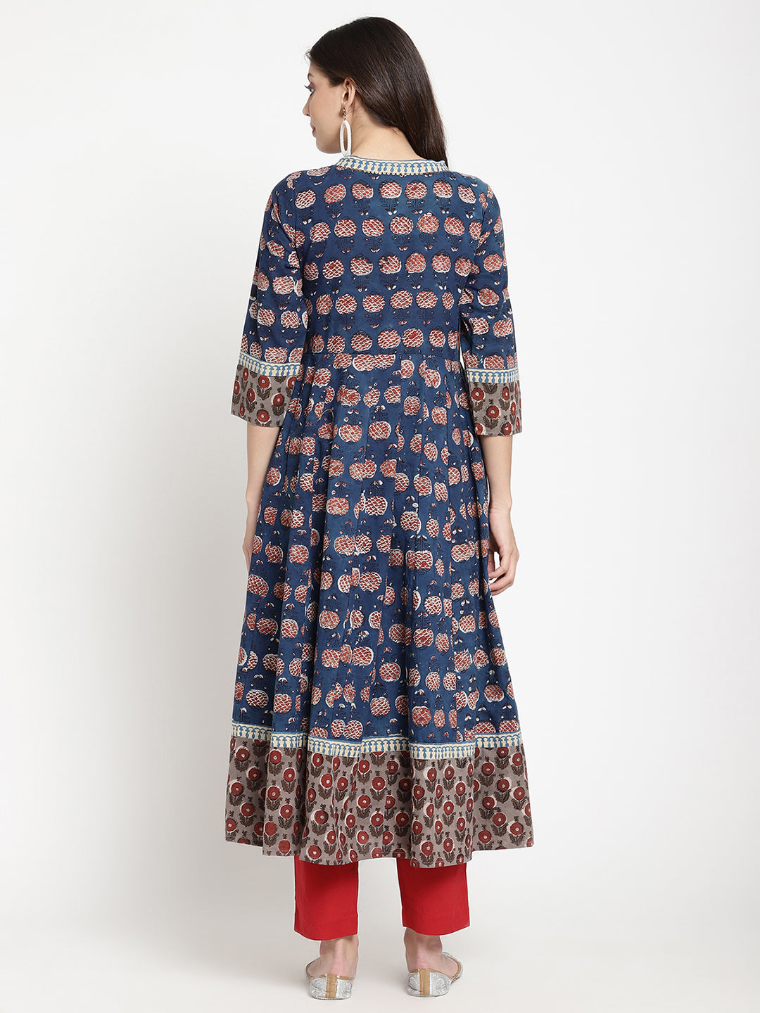 Woman posing in a blue Angrakha Anarkali Kurta.