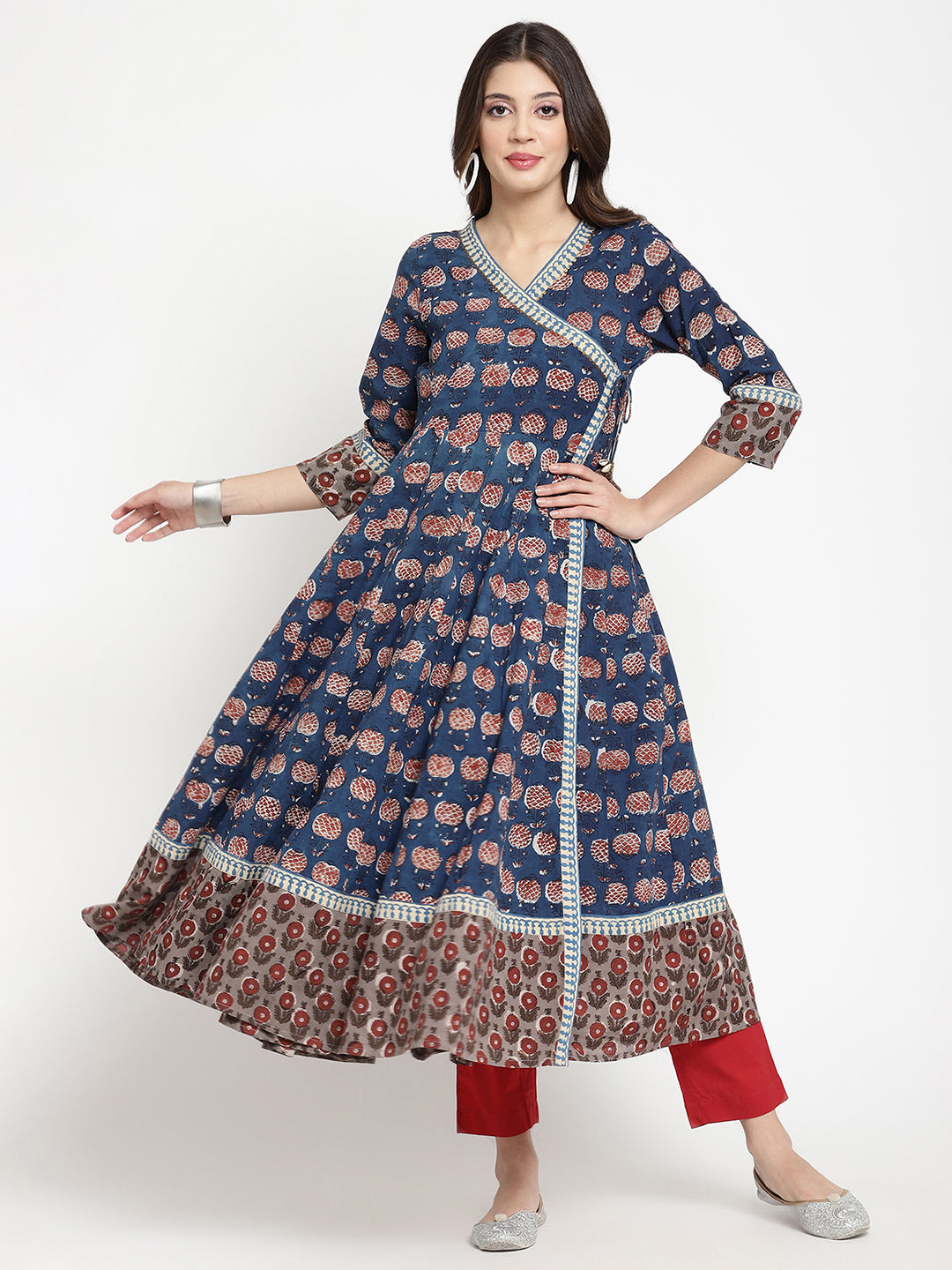 Woman posing in a blue Angrakha Anarkali Kurta.