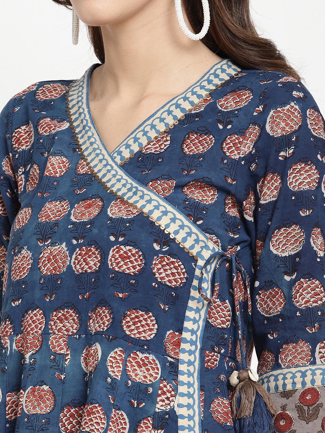 Woman posing in a blue Angrakha Anarkali Kurta.