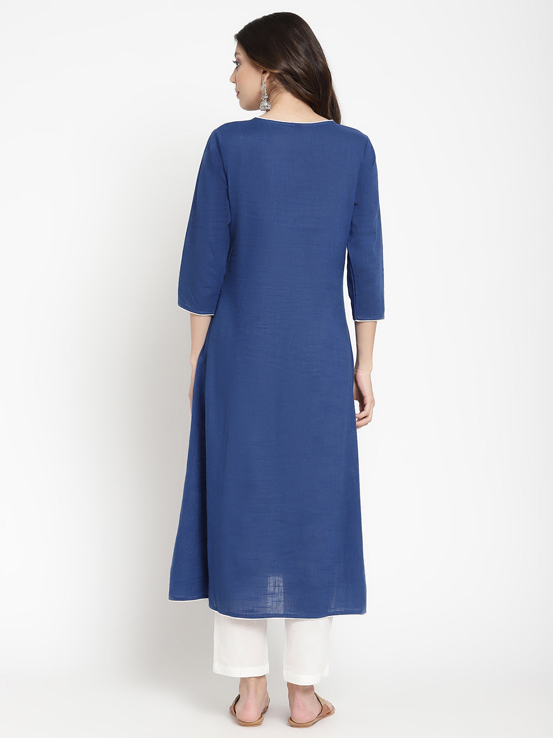 Woman posing in a blue embroidered Kurta by Savi.