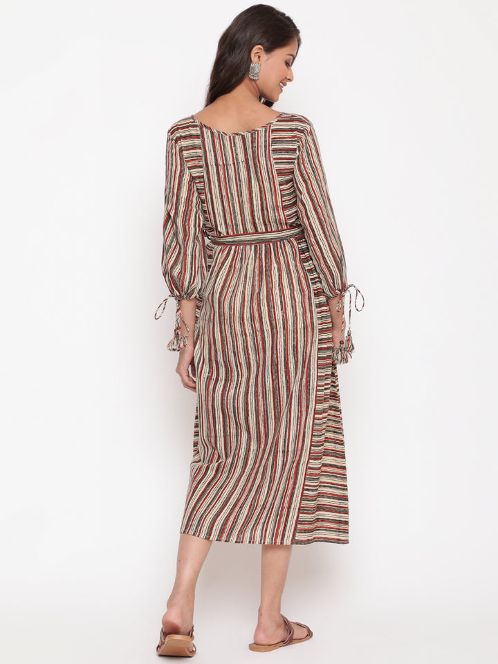 Woman posing in Savi's Cotton Block Printed tie up striped rust calf length dress