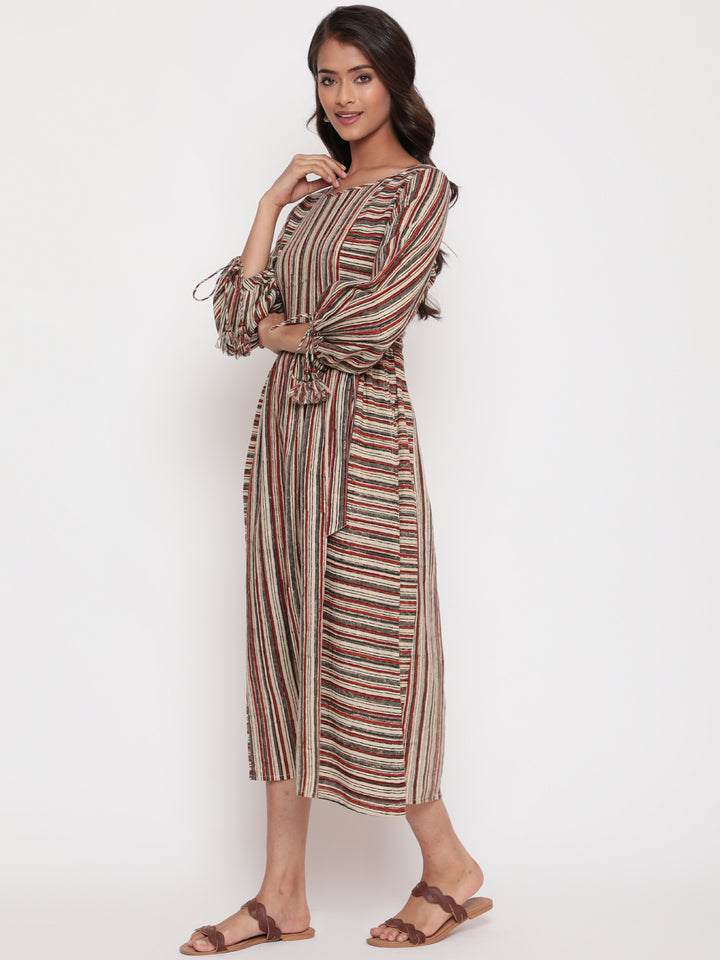 Woman posing in Savi's Cotton Block Printed tie up striped rust calf length dress
