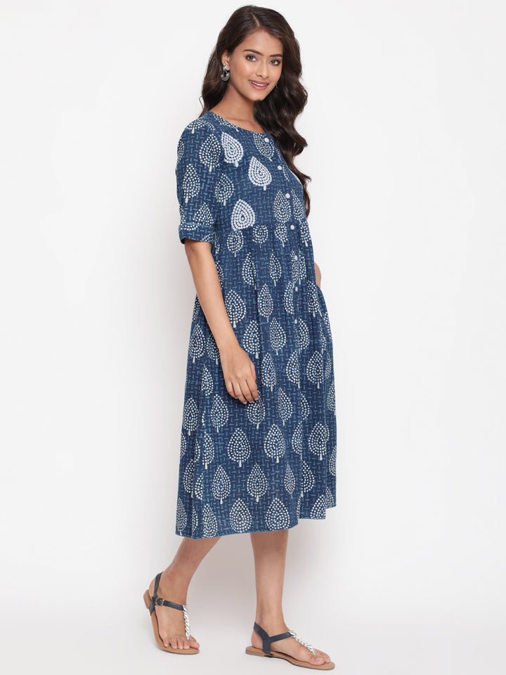 Woman posing in Savi's Cotton Indigo Ethnic Motif printed Button Closure Dress