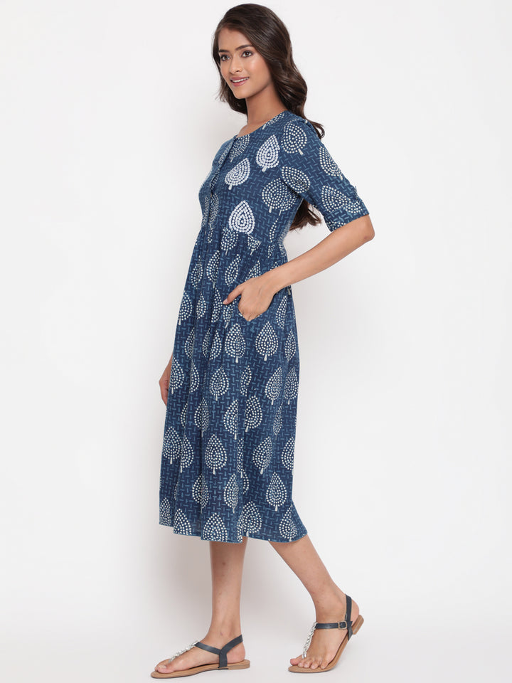 Woman posing in Savi's Cotton Indigo Ethnic Motif printed Button Closure Dress