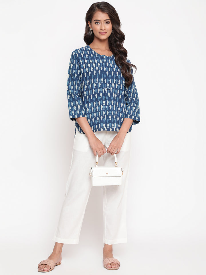 Woman posing in Savi's Cotton Indigo printed Hidden placket High-Low Tunic
