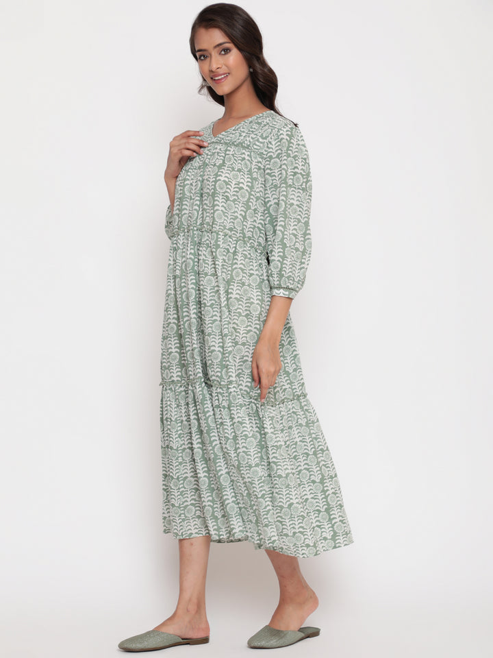 Woman posing in Savi's Cotton Printed Pintuck Yoke Teared Dress