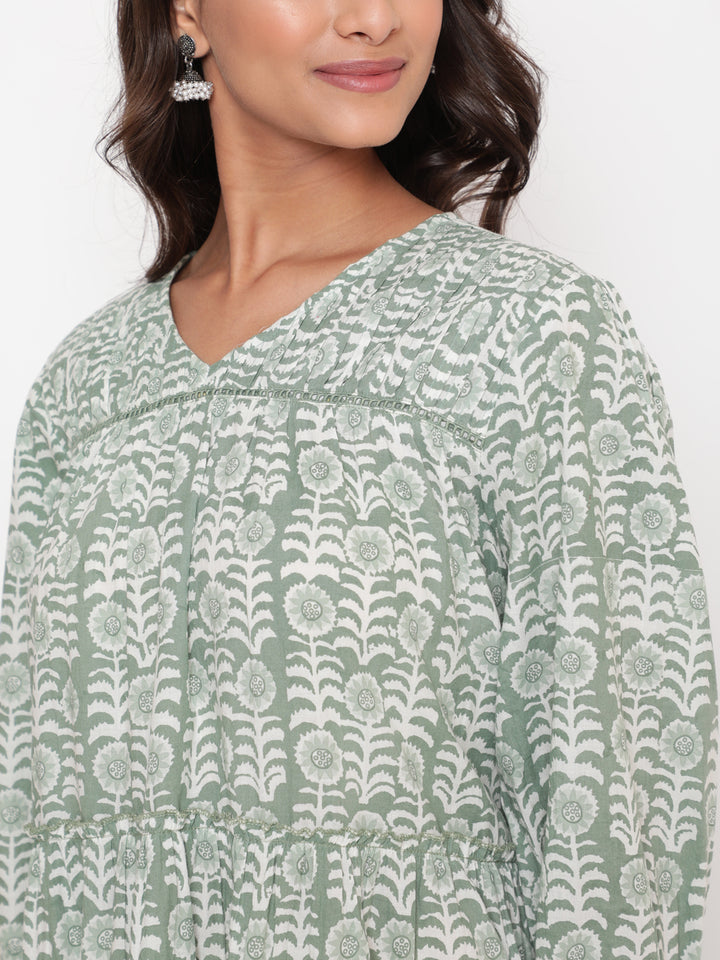 Woman posing in Savi's Cotton Printed Pintuck Yoke Teared Dress