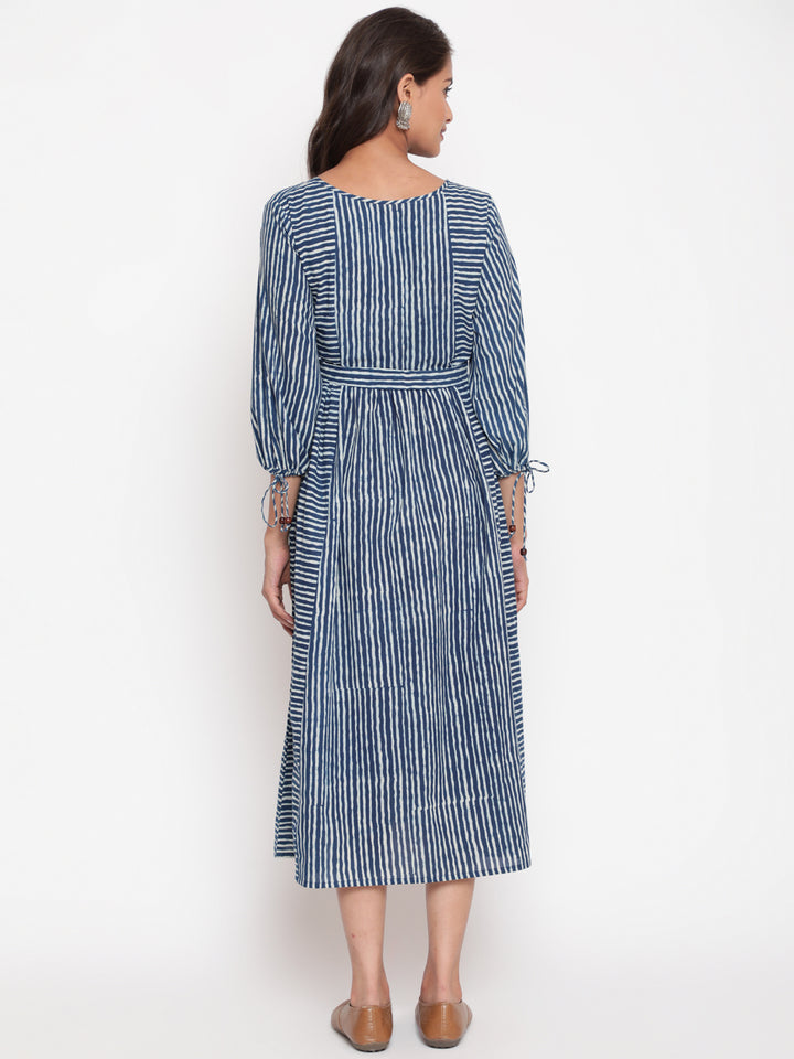 Woman posing in Savi's Cotton indigo Printed Striped Tie up designer Dress