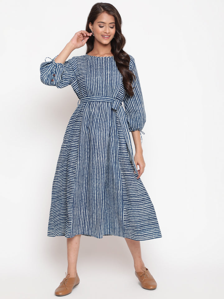 Woman posing in Savi's Cotton indigo Printed Striped Tie up designer Dress