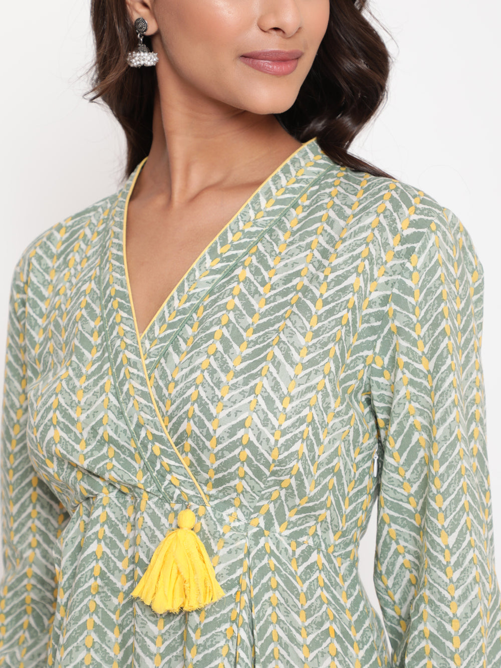 Woman posing in Savi's Cotton overlap Yoke sage Green Pleated Dress