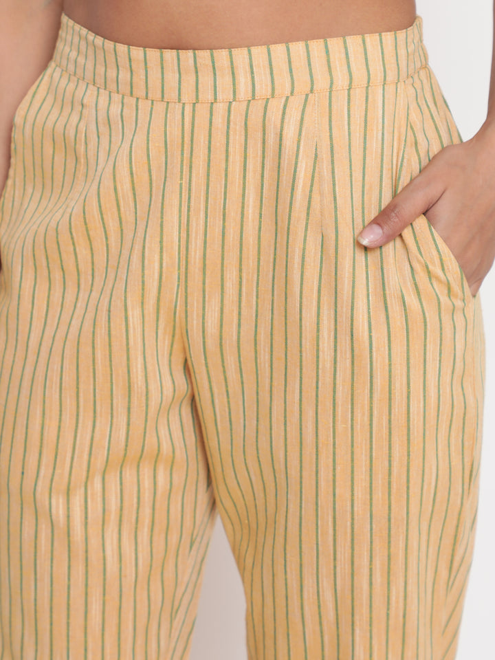 Woman posing in Savi's Cotton yarn dye Yellow Straight fit kurta With Pant