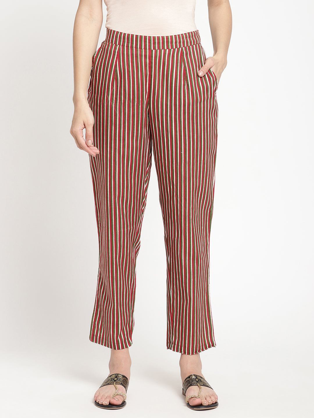 Woman wearing dark brown striped pants made of cotton fabric.