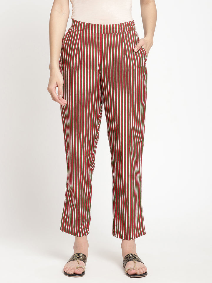 Woman wearing dark brown striped pants made of cotton fabric.
