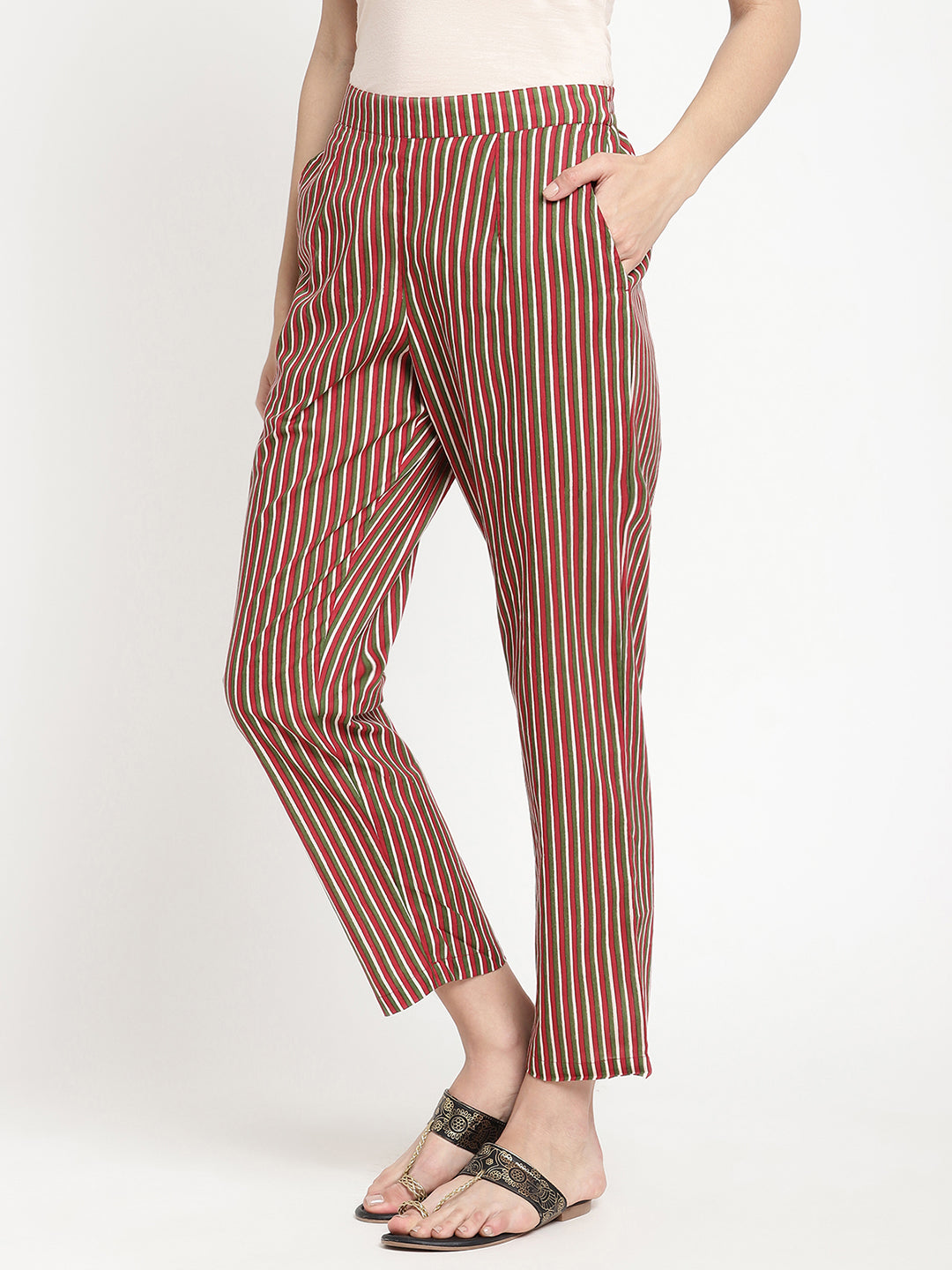 Woman wearing dark brown striped pants made of cotton fabric.