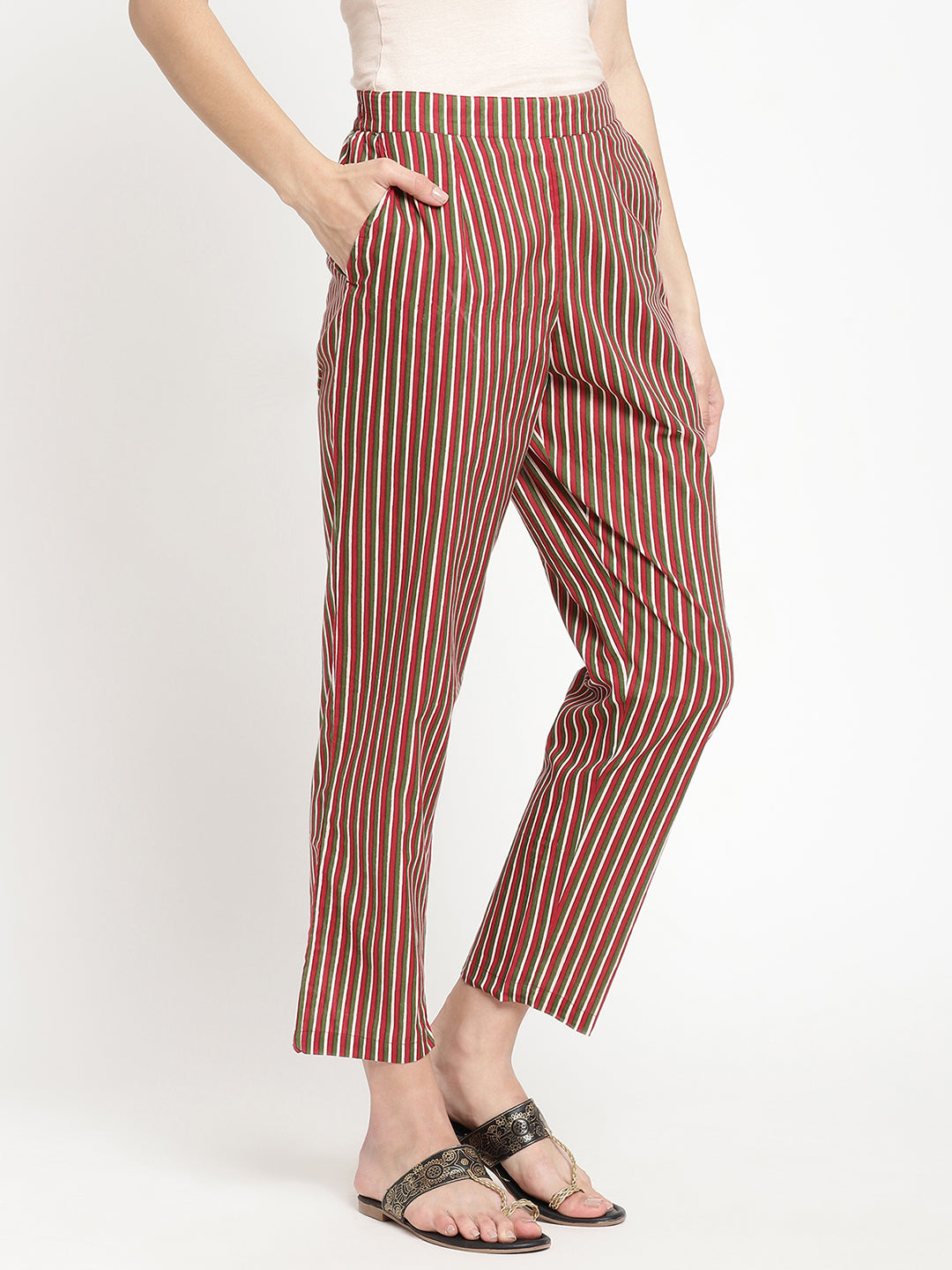 Woman wearing dark brown striped pants made of cotton fabric.