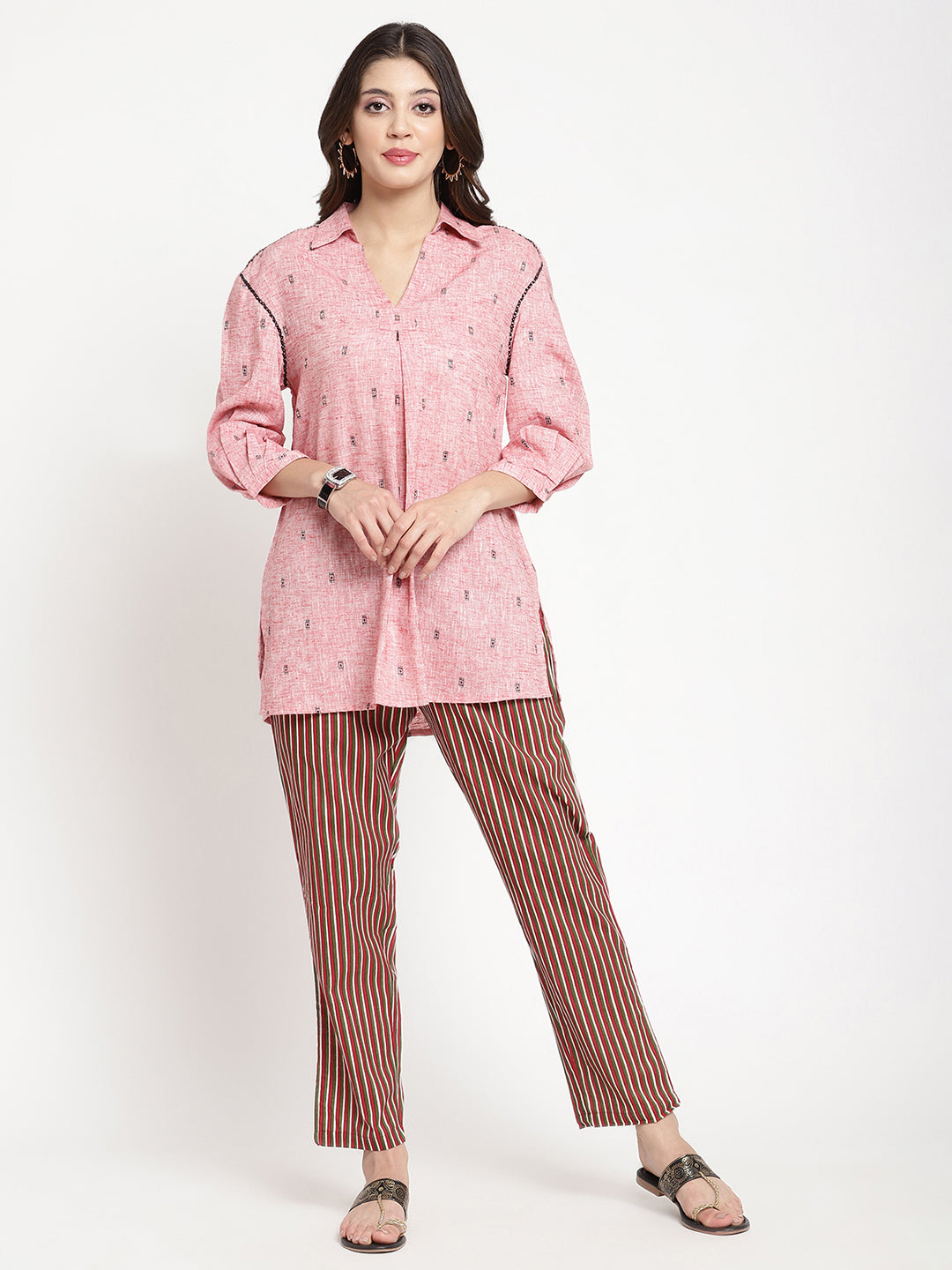 Woman wearing dark brown striped pants made of cotton fabric.