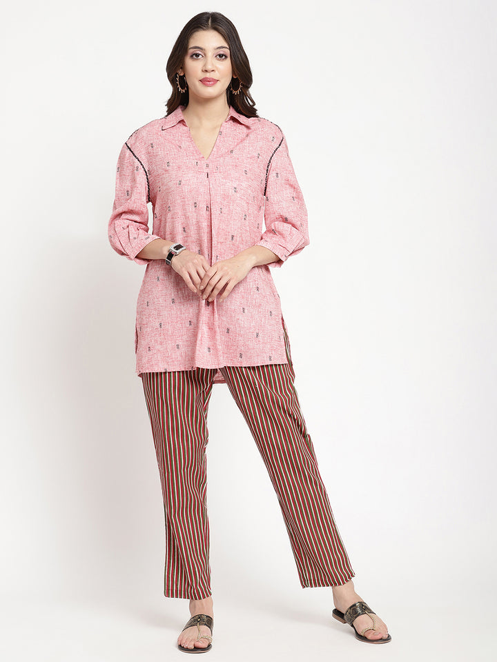 Woman wearing dark brown striped pants made of cotton fabric.