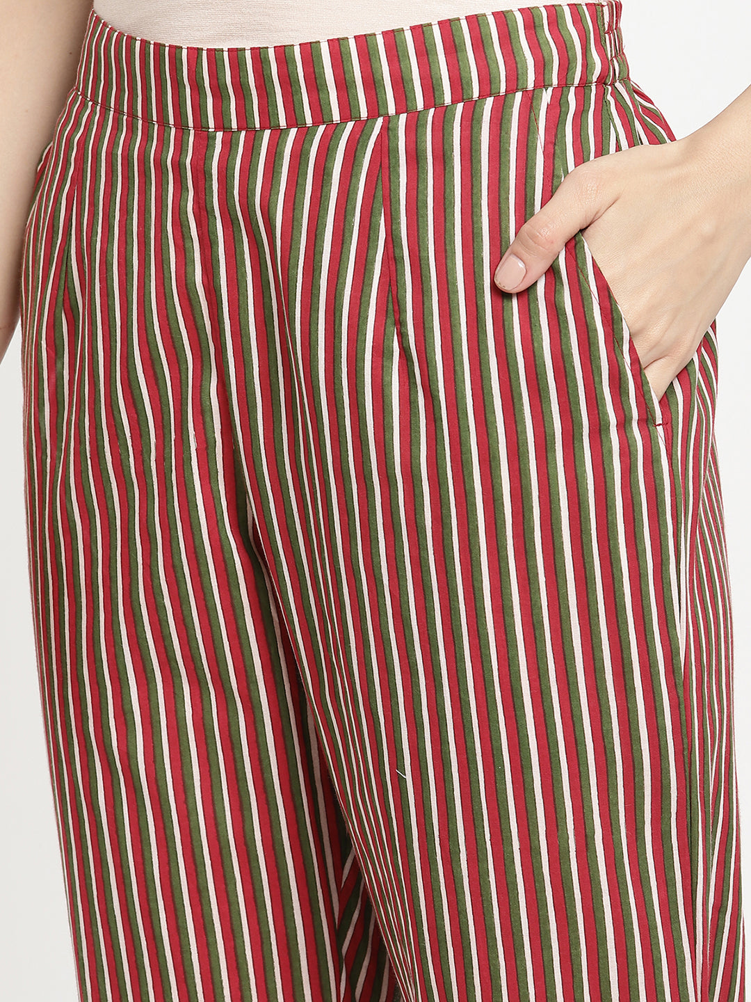 Woman wearing dark brown striped pants made of cotton fabric.