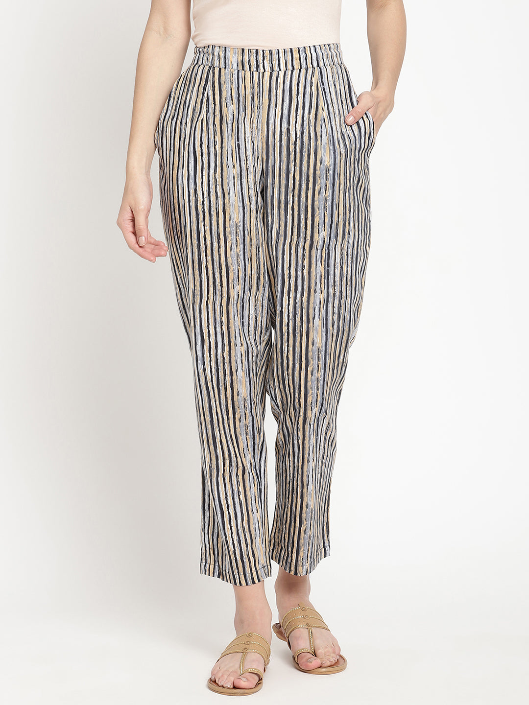 One of the Savi Women wearing dark grey pants crafted from cotton fabric.