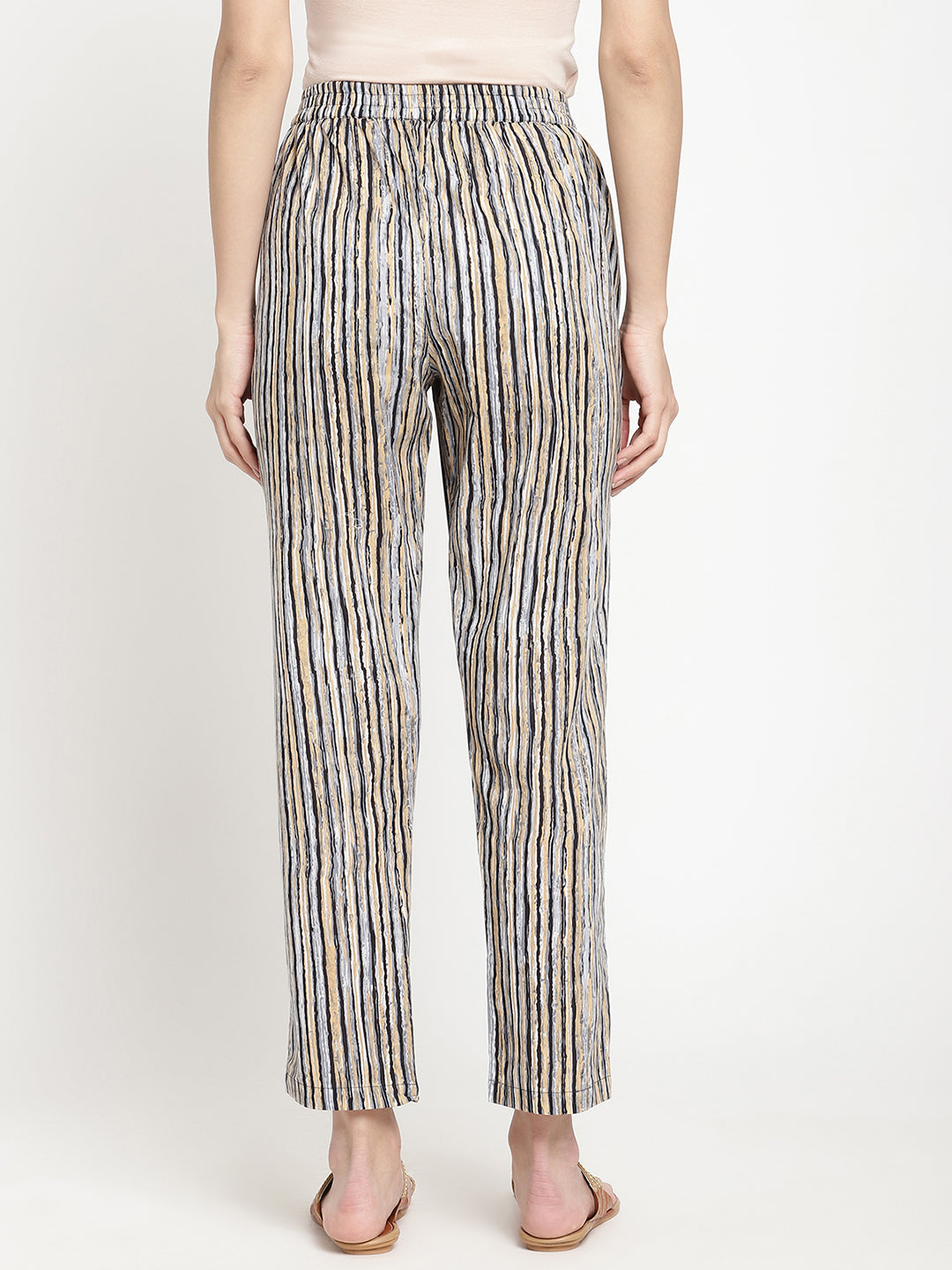 One of the Savi Women wearing dark grey pants crafted from cotton fabric.