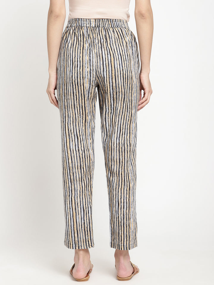 One of the Savi Women wearing dark grey pants crafted from cotton fabric.