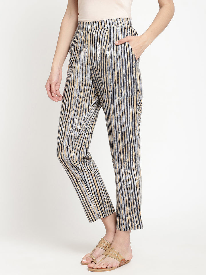 One of the Savi Women wearing dark grey pants crafted from cotton fabric.