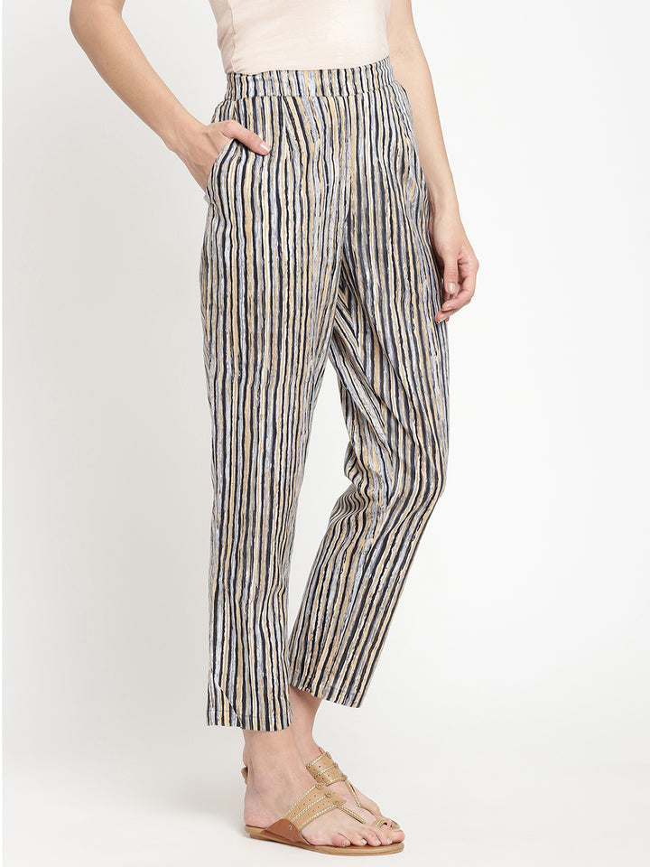 One of the Savi Women wearing dark grey pants crafted from cotton fabric.