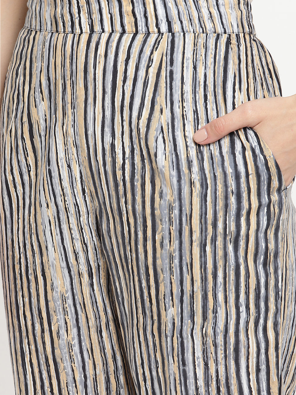 One of the Savi Women wearing dark grey pants crafted from cotton fabric.