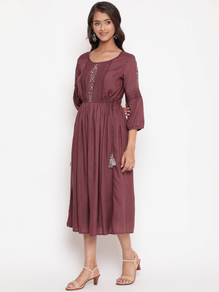 Woman posing in Wine Embroidered Tie Up Flared Dress