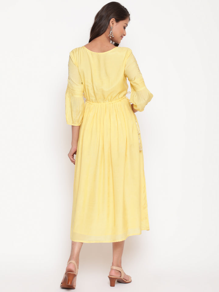 Woman posing in Embroidered Flared Tie Up Yellow Dress