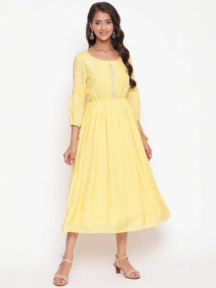 Woman posing in Embroidered Flared Tie Up Yellow Dress