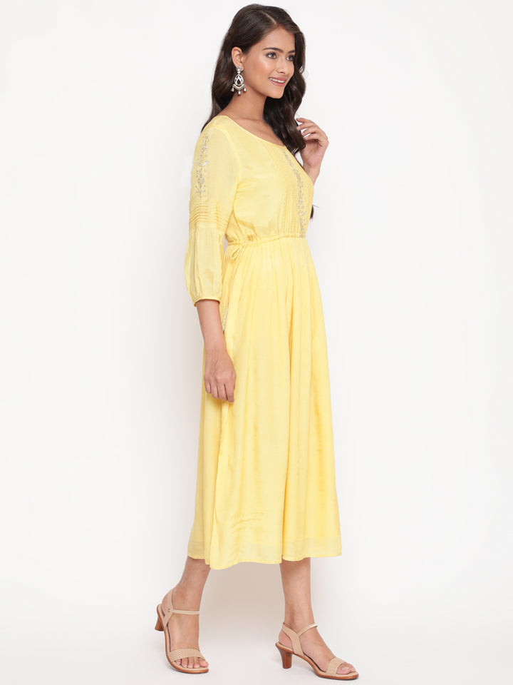 Woman posing in Embroidered Flared Tie Up Yellow Dress